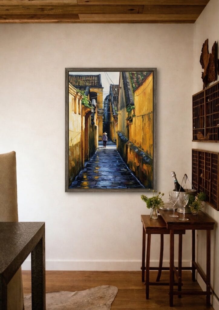 Detail close-up of Hoi An yellow alleyway painting showing wet street reflections and impasto texture